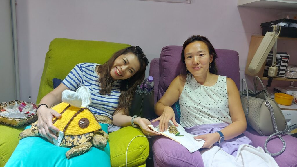 Satisfied customer showcasing minimalist nail art with a modern twist